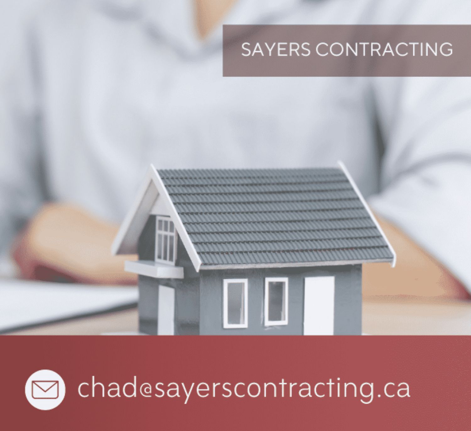 Sayers Contracting contact information with a miniature house model in the foreground and email address for inquiries.