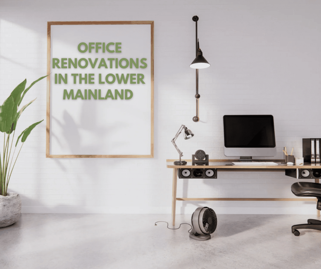 Modern minimalist office space with a sleek wooden desk, computer setup, industrial-style lighting, and a large framed sign reading 'Office Renovations in the Lower Mainland,' promoting Sayers Contracting services.