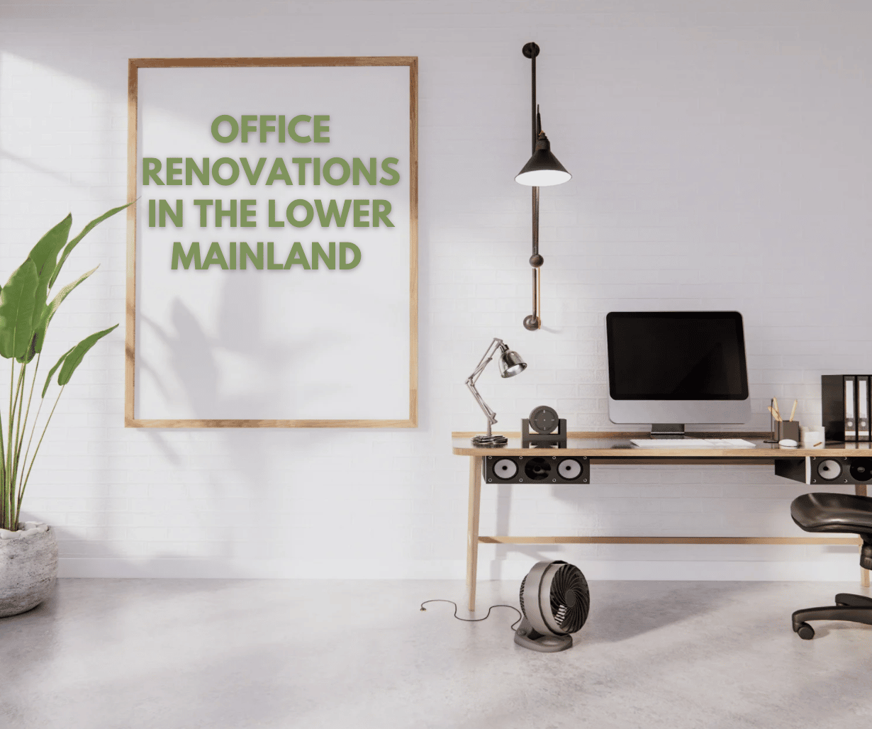 Modern minimalist office space with a sleek wooden desk, computer setup, industrial-style lighting, and a large framed sign reading 'Office Renovations in the Lower Mainland,' promoting Sayers Contracting services.