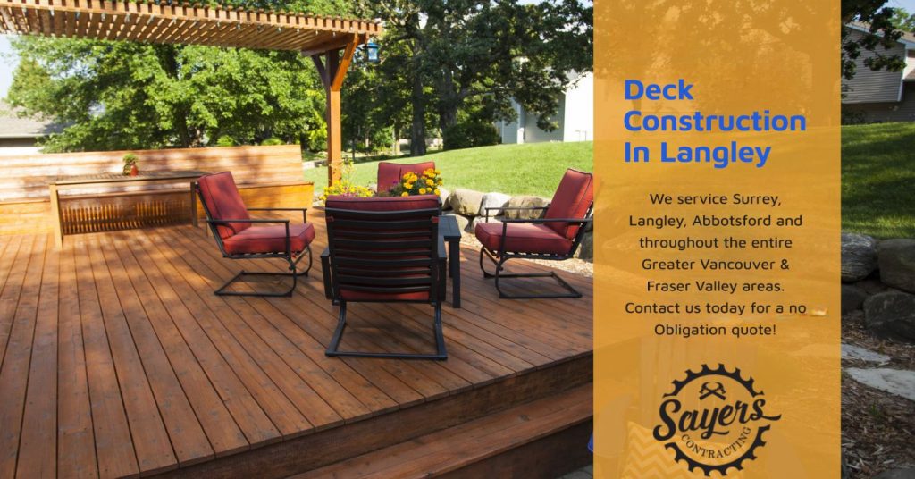 Wooden deck with pergola, outdoor seating, and vibrant landscaping. Text overlay promoting deck construction services in Langley by Sayers Contracting.
